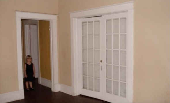 young girl standing in hall