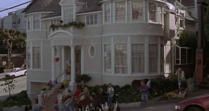 A group of people in front of Mrs. Doubtfire house