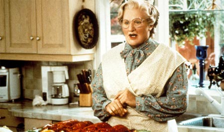 Euphegenia Doubtfire preparing food in a kitchen