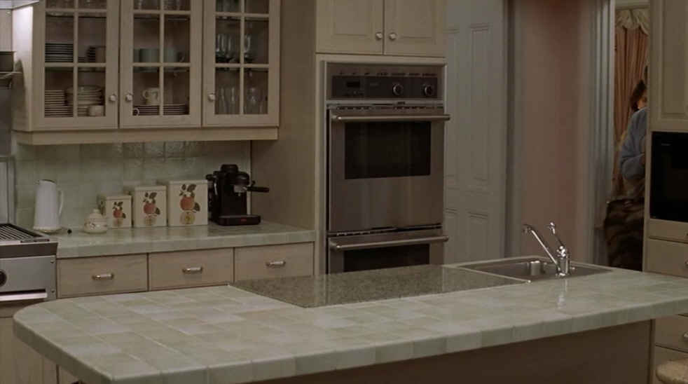 screenshot of kitchen in Mrs. Doubtfire with double ovens and tile countertops