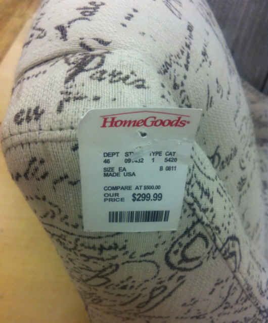 A close up of a price tag on chair saying $299.99