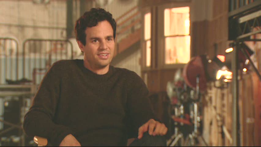 Mark Ruffalo sitting on a table