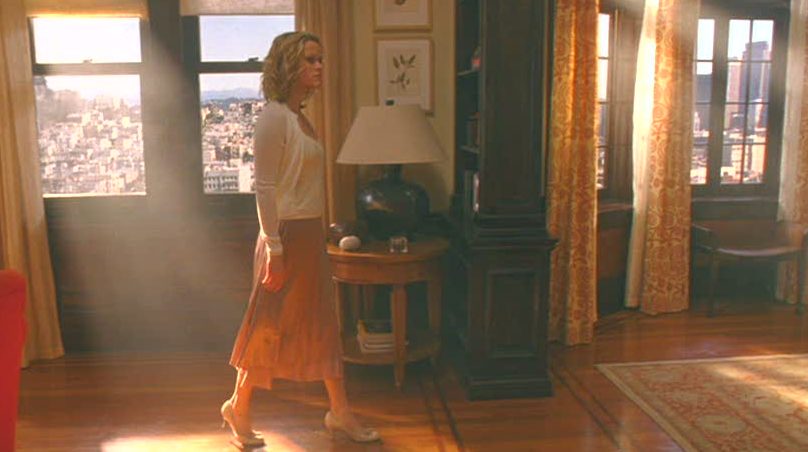 Reese Witherspoon walking through apartment