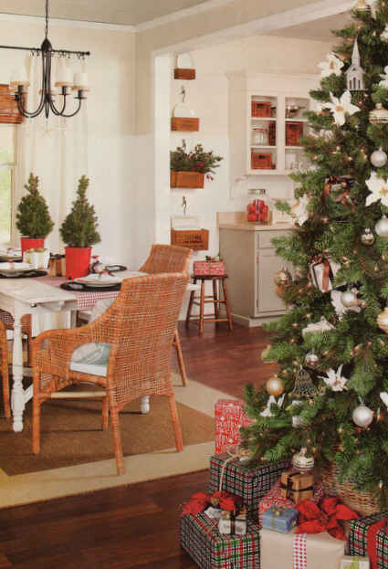 dining table and wicker chairs beside Christmas tree