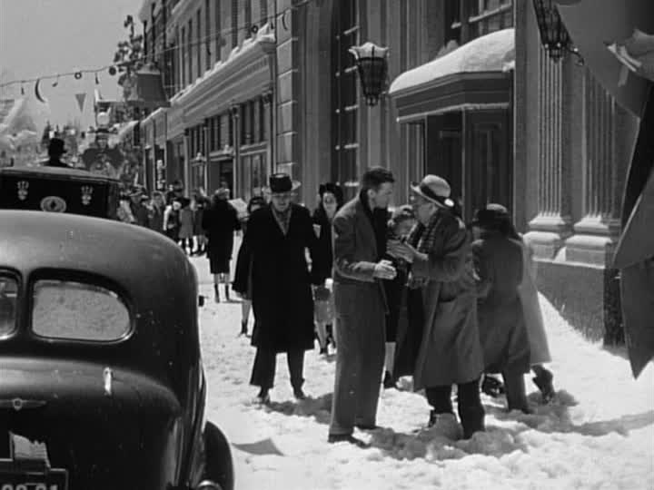 George Bailey on the street of Bedford Falls in the snow