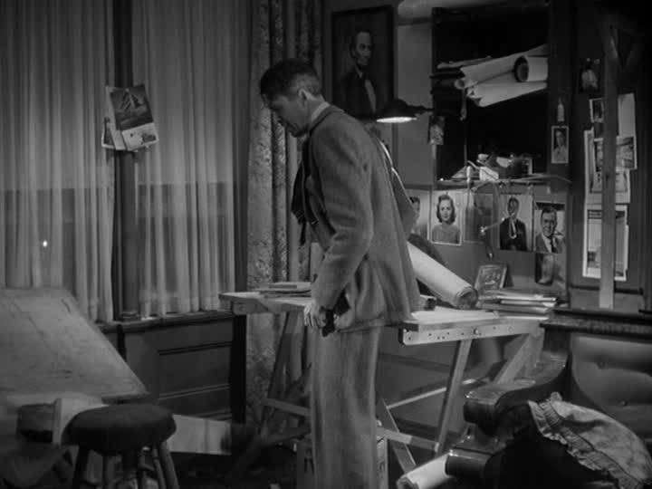 George Bailey pacing by his drafting table