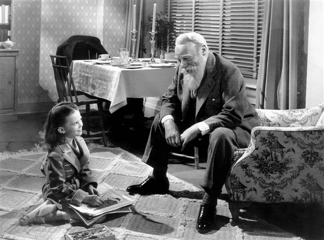 Natalie Wood laughing with Edmund Gwenn in Miracle on 34th Street