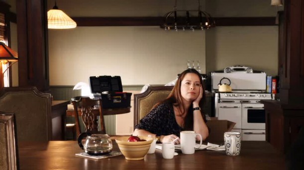 A woman sitting at a table