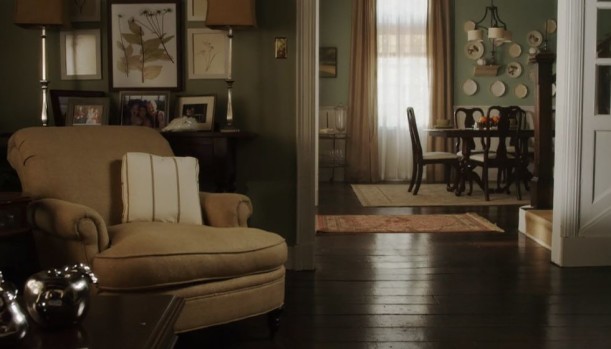 A living room filled with furniture and a large window