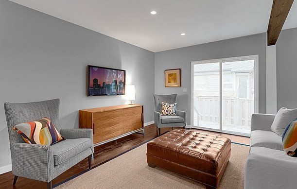 A living room filled with furniture and a flat screen tv