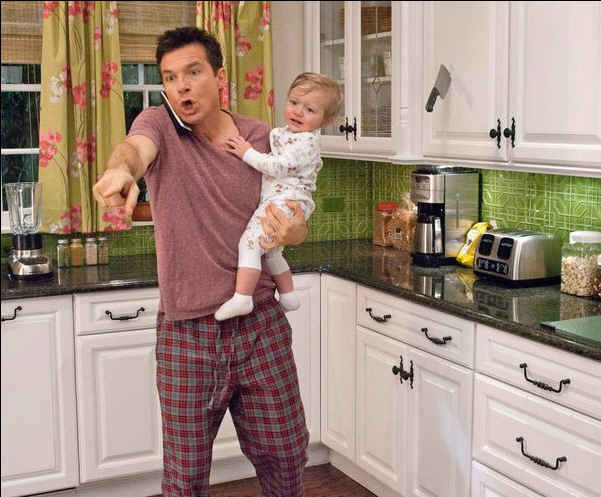 Jason Bateman standing in a kitchen