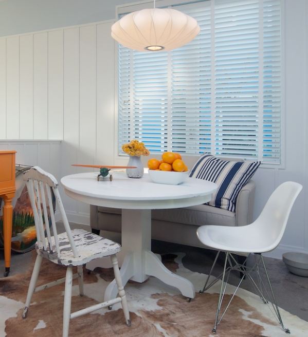 A dining room table in front of a window