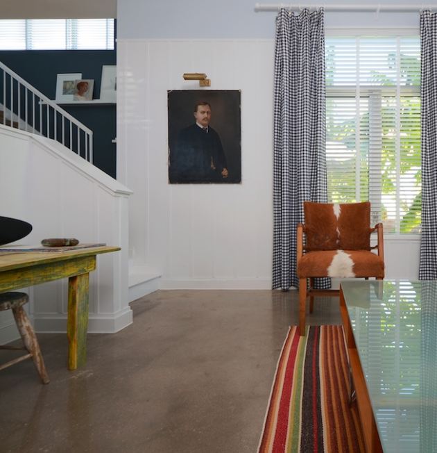 A living room filled with furniture and a large window