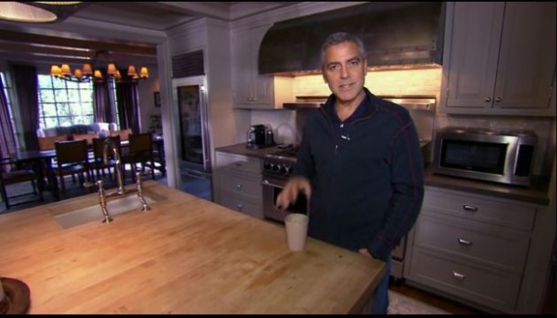 George Clooney standing in a kitchen