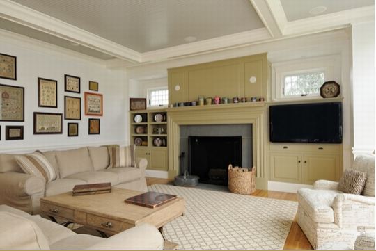 A living room filled with furniture and a fireplace