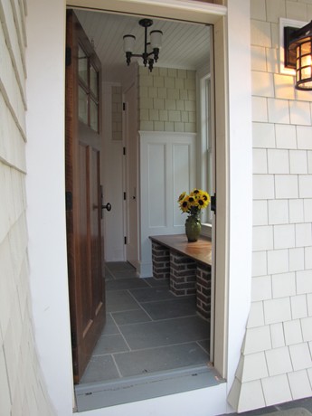 mudroom with bench at back of house