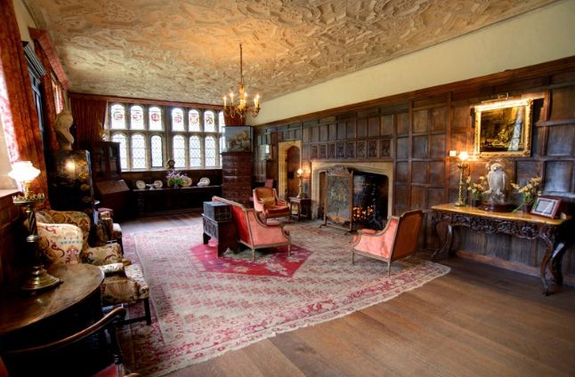 A living room filled with furniture and a fire place