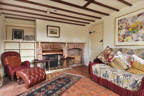 A living room filled with furniture and a fireplace