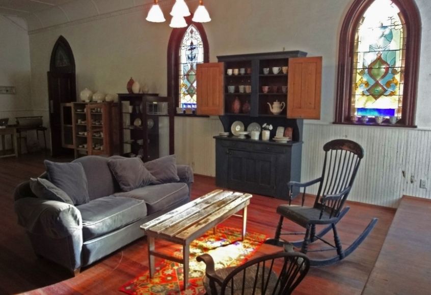 A living room filled with furniture and a fireplace