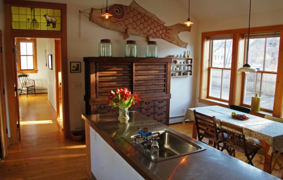 kitchen with large sculpture of fish on wall