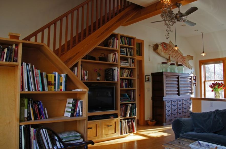 A living room with a book shelf