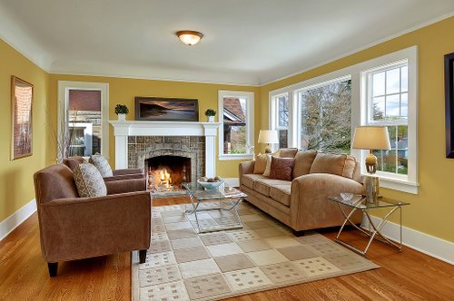 A living room filled with furniture and a fire place