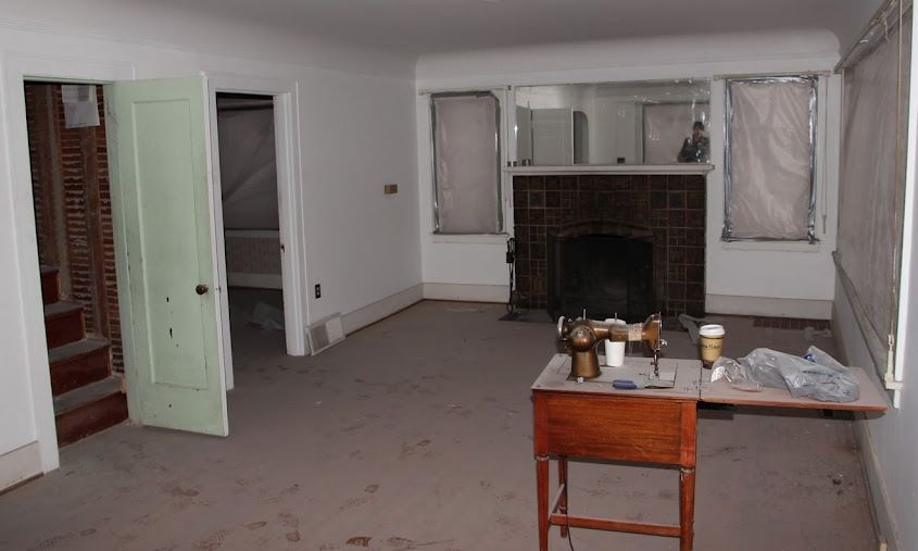 empty living room with fireplace before remodel