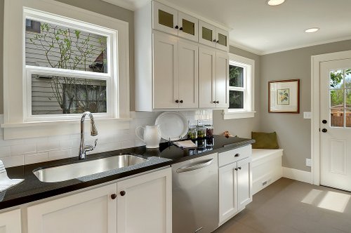 A kitchen with a sink and a window