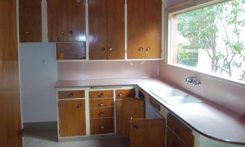 A kitchen with a sink and a window