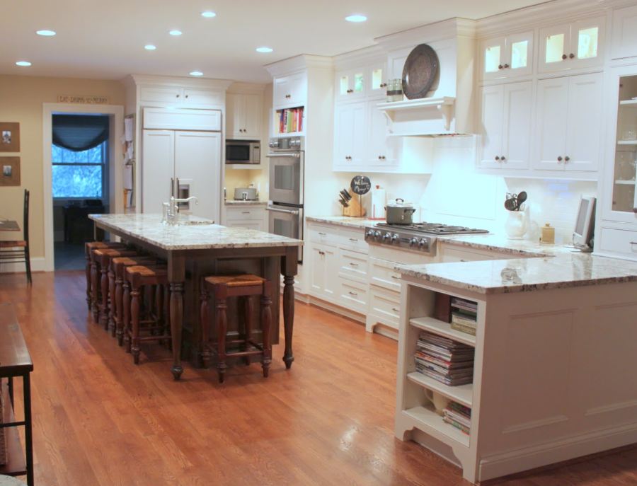 A kitchen with a wood floor in a room