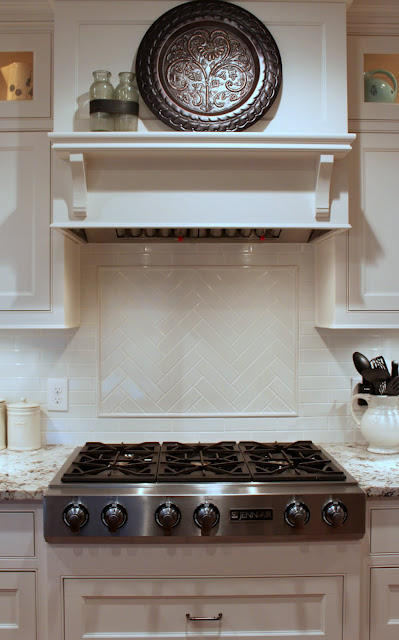 A stove top oven sitting inside of a kitchen