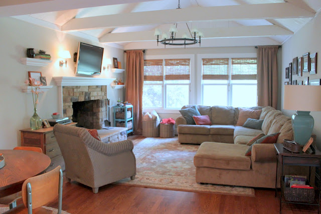 A living room filled with furniture and a fire place