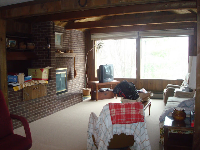 A living room filled with furniture and a large window