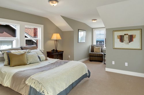 A bedroom with slanted ceilings