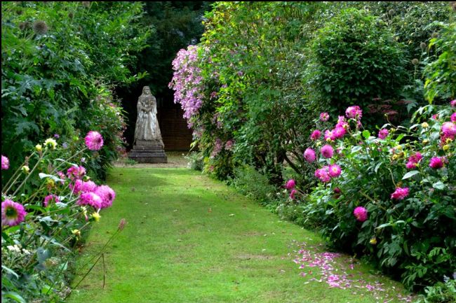 flower garden with statue of Queen Victoria