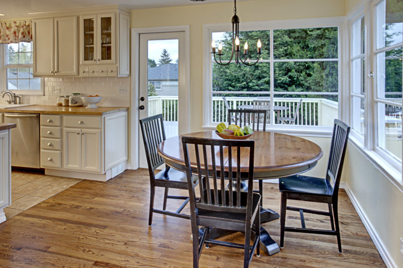 A dining room table in front of a window