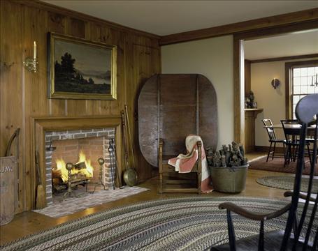 A living room filled with furniture and a fire place