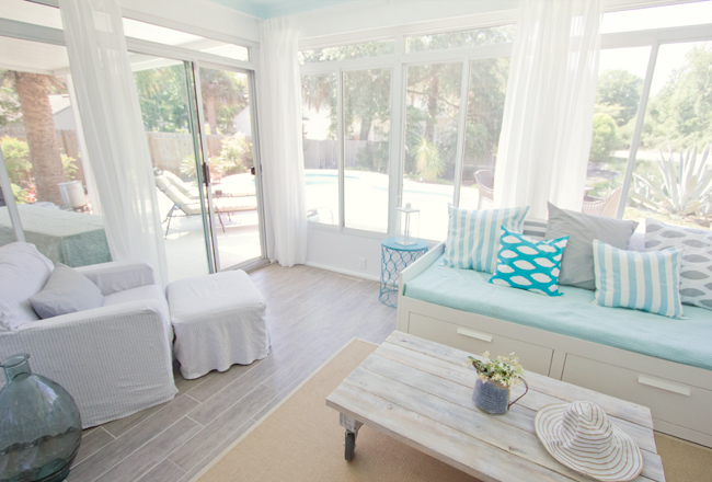 sliding doors leading to pool behind sunroom