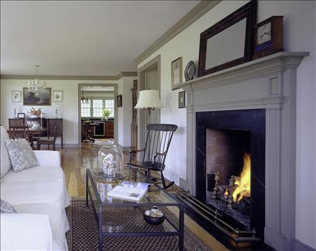 A living room filled with furniture and a fire place