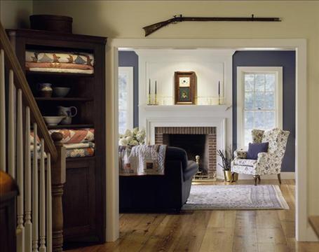 A living room filled with furniture and a fire place