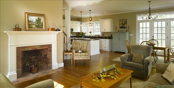 A living room filled with furniture and a fire place