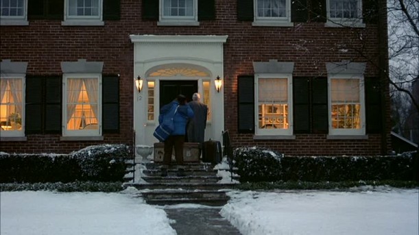 Steve Martin and John Candy walking up to house on snowy day