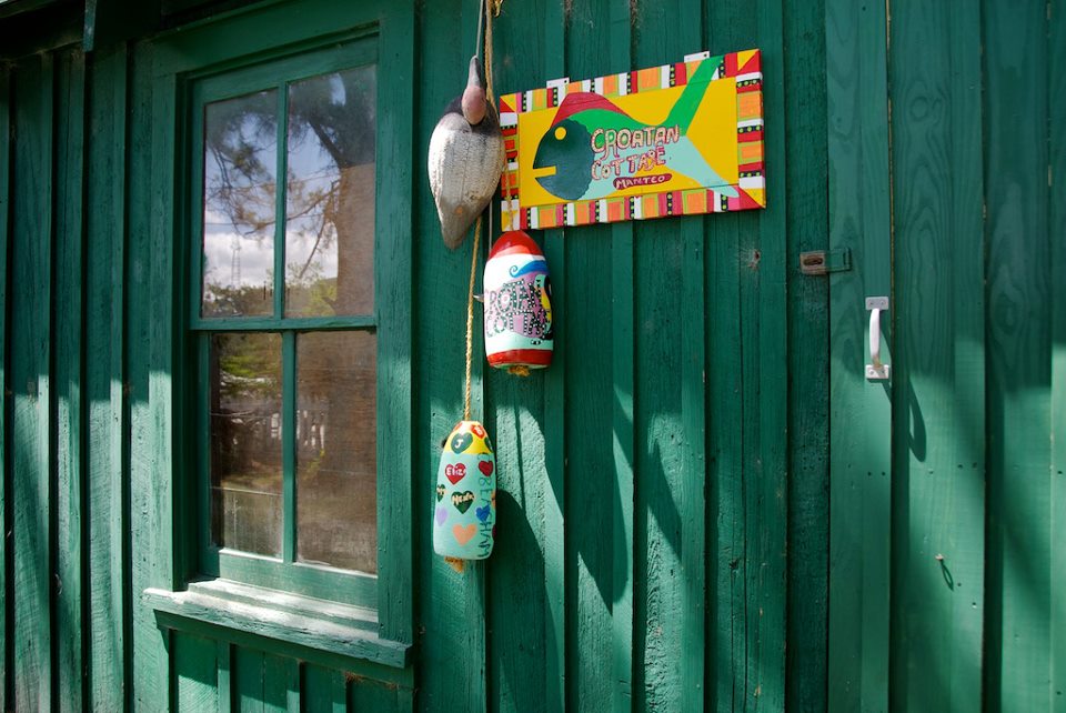 green shed behind cottage