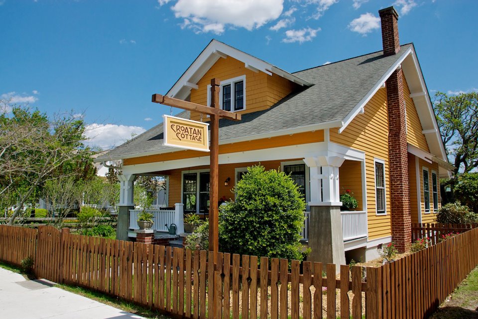 front exterior of yellow cottage that was a Sears Kit home called Vallonia