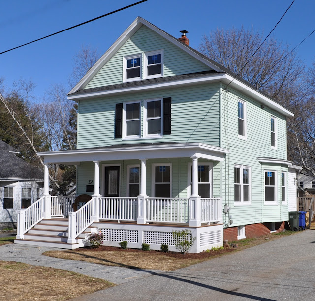 front exterior of traditional house with shutters