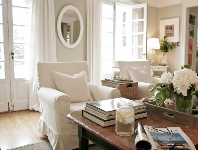 A living room filled with furniture and a large window