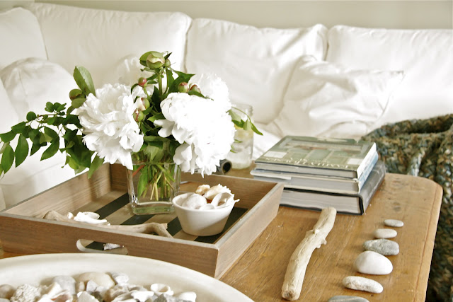 coffee table with vase filled with flowers