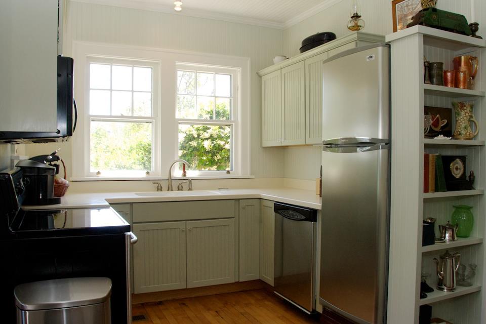 A kitchen with a sink and a window