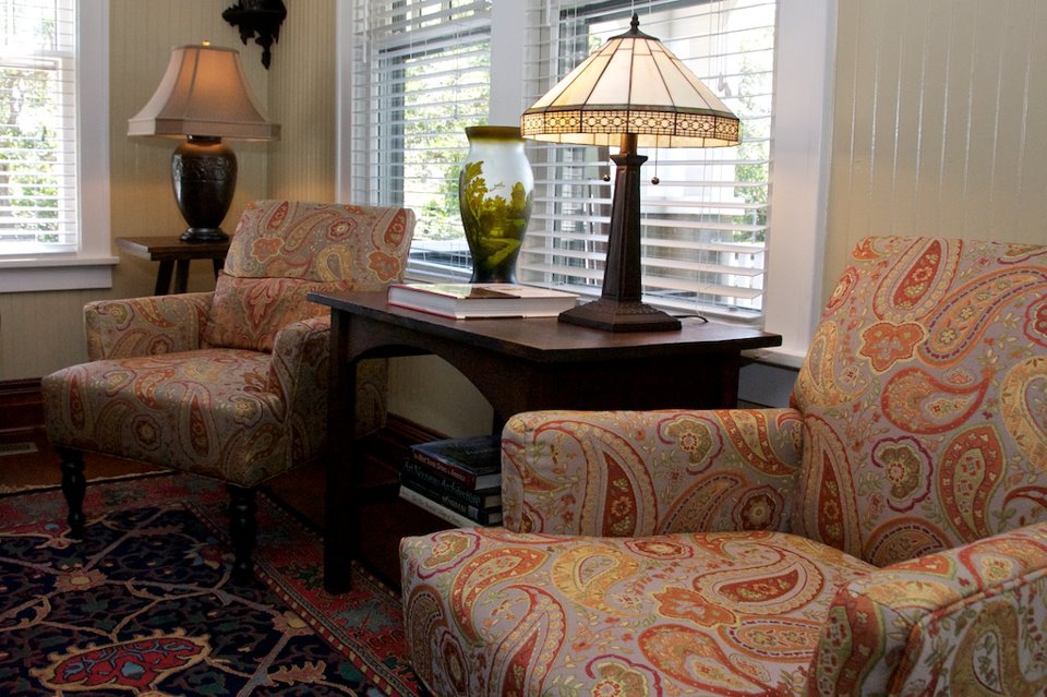 A living room filled with furniture and a large window