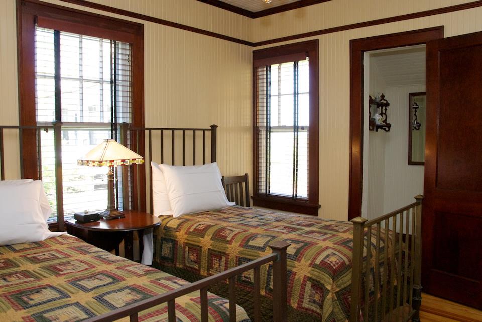 bedroom with two twin beds and iron headboards